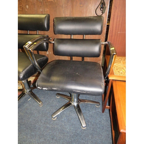 777 - THREE BLACK & CHROME SWIVEL ARMCHAIRS