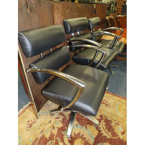 777 - THREE BLACK & CHROME SWIVEL ARMCHAIRS