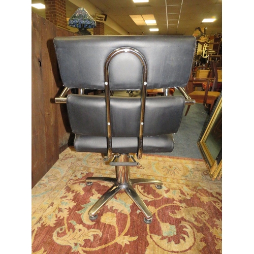 777 - THREE BLACK & CHROME SWIVEL ARMCHAIRS