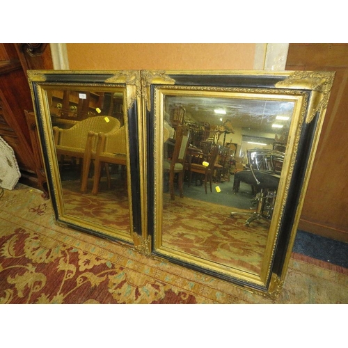 779 - A PAIR OF  MODERN BLACK AND GILT RECTANGULAR WALL MIRRORS 94 X 69 CM (2)