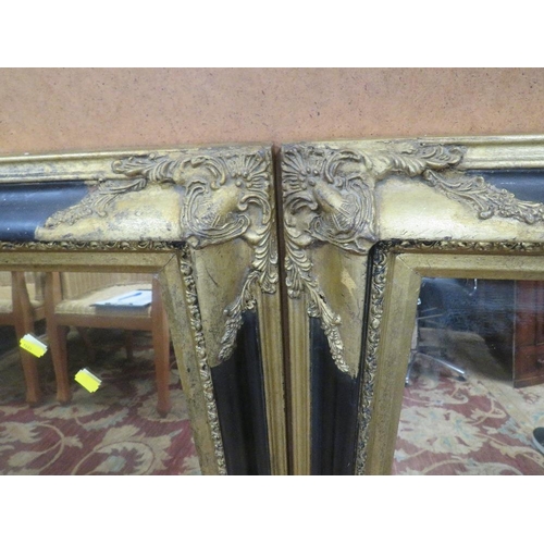 779 - A PAIR OF  MODERN BLACK AND GILT RECTANGULAR WALL MIRRORS 94 X 69 CM (2)