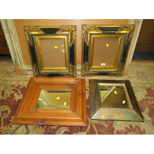 780 - A PAIR OF MODERN BLACK AND GILT FRAMES 44 X 39 CM TOGETHER WITH TWO MIRRORS (4)