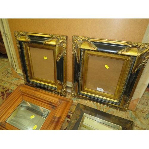 780 - A PAIR OF MODERN BLACK AND GILT FRAMES 44 X 39 CM TOGETHER WITH TWO MIRRORS (4)