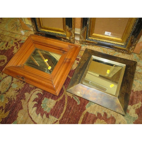 780 - A PAIR OF MODERN BLACK AND GILT FRAMES 44 X 39 CM TOGETHER WITH TWO MIRRORS (4)