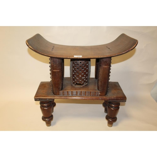 116 - A GHANAIAN ASHANTI HARDWOOD STOOL, with later added feet, overall H 55 cm, without feet H 33.5 cm