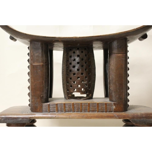 116 - A GHANAIAN ASHANTI HARDWOOD STOOL, with later added feet, overall H 55 cm, without feet H 33.5 cm