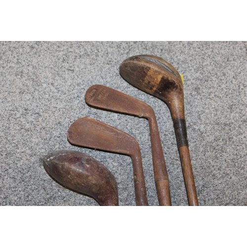 94 - A LARGE QUANTITY OF VINTAGE WOODEN HANDLED GOLF CLUBS, some marked C H Clay, together with a quantit... 