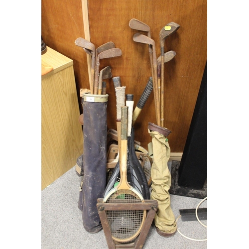 94 - A LARGE QUANTITY OF VINTAGE WOODEN HANDLED GOLF CLUBS, some marked C H Clay, together with a quantit... 