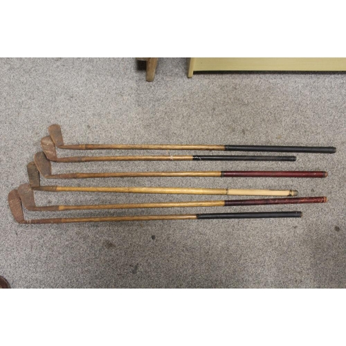 94 - A LARGE QUANTITY OF VINTAGE WOODEN HANDLED GOLF CLUBS, some marked C H Clay, together with a quantit... 