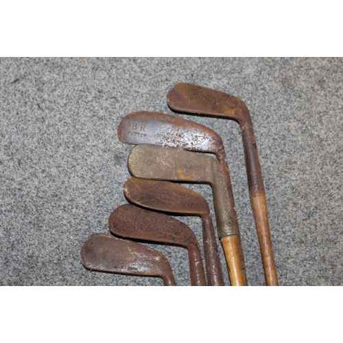 94 - A LARGE QUANTITY OF VINTAGE WOODEN HANDLED GOLF CLUBS, some marked C H Clay, together with a quantit... 