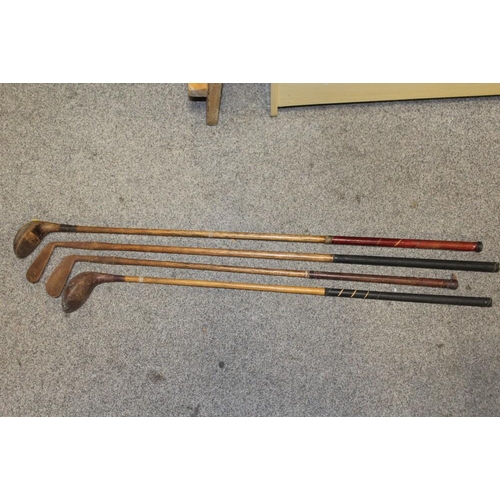 94 - A LARGE QUANTITY OF VINTAGE WOODEN HANDLED GOLF CLUBS, some marked C H Clay, together with a quantit... 