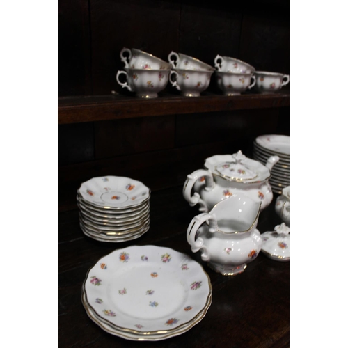 98 - A TRAY OF VINTAGE GERMAN FLORAL CHINA TO INCLUDE A TEAPOT