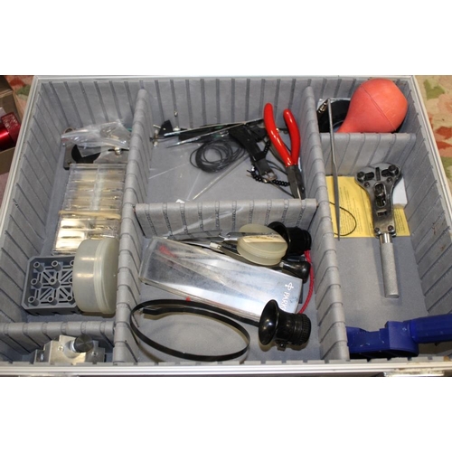 124 - A HARD CASE CONTAINING WATCH MAKERS / REPAIRER TOOLS TO INCLUDE PARTS ETC