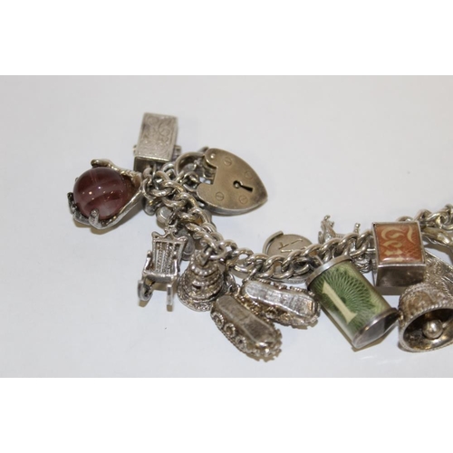 368 - A HEAVY SILVER VINTAGE CHARM BRACELET, APPROX WEIGHT 114 G