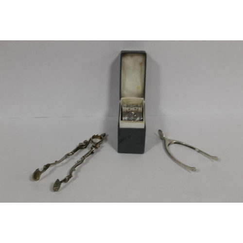 374 - A HALLMARKED SILVER WISH BONE SUGAR TONGS, H.M. SILVER NAPKIN RINGS AND WHITE METAL TONGS