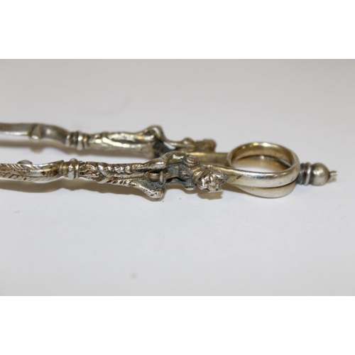 374 - A HALLMARKED SILVER WISH BONE SUGAR TONGS, H.M. SILVER NAPKIN RINGS AND WHITE METAL TONGS