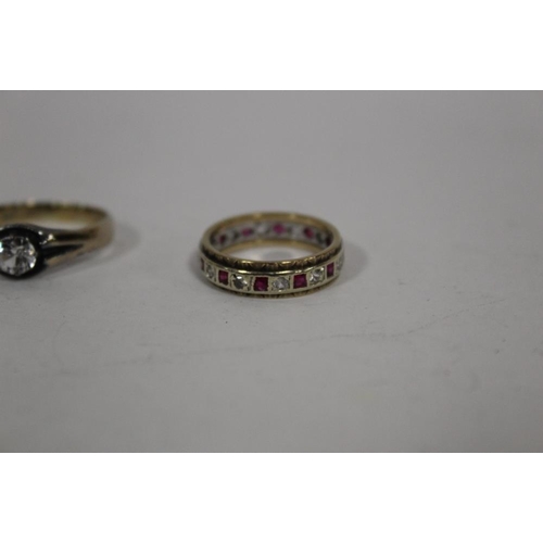 403 - A WHITE METAL SOLITAIRE RING STAMPED 18CT TWICE TOGETHER WITH AN ETERNITY RING (2)