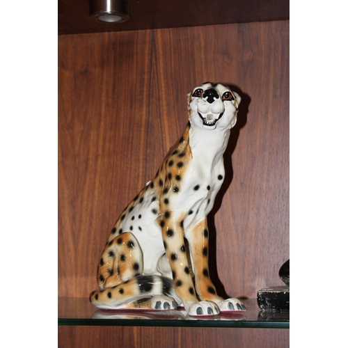 296 - A VINTAGE CHALK FIGURE OF AN ALSATIAN FIGURE W 57 CM, TOGETHER WITH A FIRESIDE SEATED CHEETAH FIGURE... 