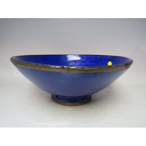 336 - A LIBERTY POTTERY FRUIT BOWL WITH BANDED RIM AND BASE - DIA 35 CM