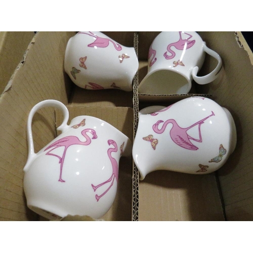 101 - A QUANTITY OF BOXED DENISE O'SULLIVAN CERAMIC FLAMINGO PATTERN JUGS AND SUGAR BOWLS