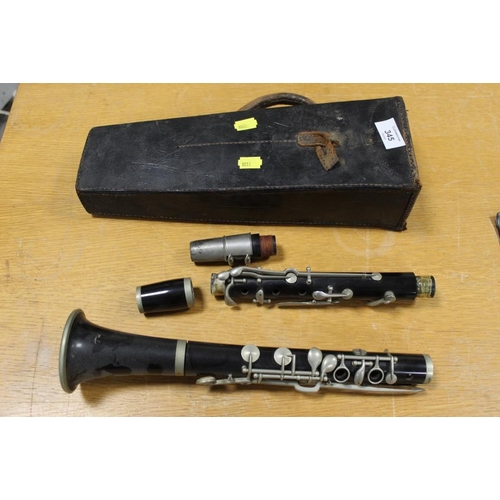 345 - A VINTAGE CLARINET IN LEATHER CARRY CASE, CASE WITH DAMAGES