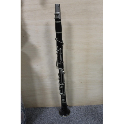 345 - A VINTAGE CLARINET IN LEATHER CARRY CASE, CASE WITH DAMAGES