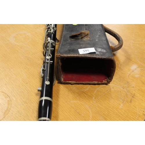 345 - A VINTAGE CLARINET IN LEATHER CARRY CASE, CASE WITH DAMAGES