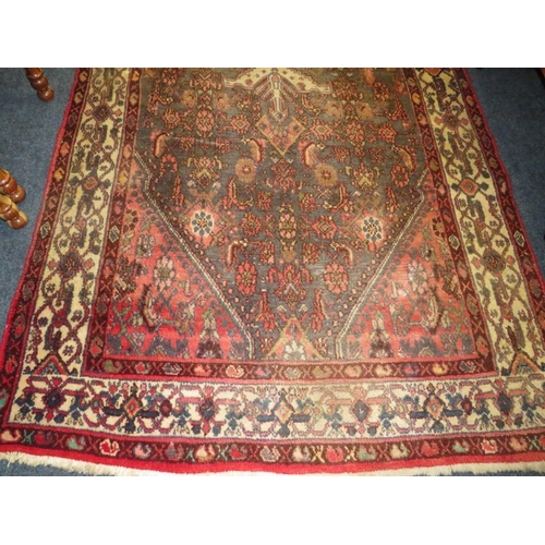 841 - A PERSIAN WOOLLEN RUNNER / CARPET, MAINLY RED AND BLACK GROUND - FADED -  282 X 131 CM