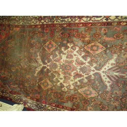 841 - A PERSIAN WOOLLEN RUNNER / CARPET, MAINLY RED AND BLACK GROUND - FADED -  282 X 131 CM