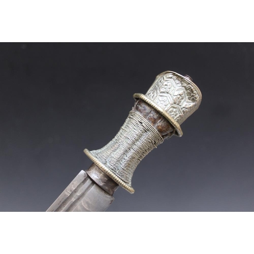 909 - A TIBETAN TYPE DAGGER AND SCABBARD, L 34 cmCondition Report:bumps to pommel and scabbard... 