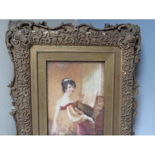 257 - (XIX). Study on ivory of a young woman playing a piano, unsigned, framed and glazed, 17 x 12.5 cm