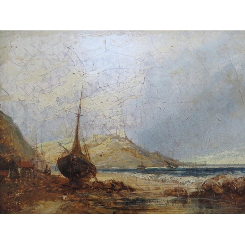 37 - (XIX).  A rocky shore scene with beached fishing boats and hill top buildings beyond, unsigned, oil ... 