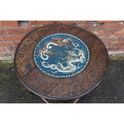 1028 - A CHINESE STYLE HARDWOOD CIRCULAR FAUX BAMBOO TABLE WITH INSET CIRCULAR CLOISONNE PLAQUE, the hardwo... 