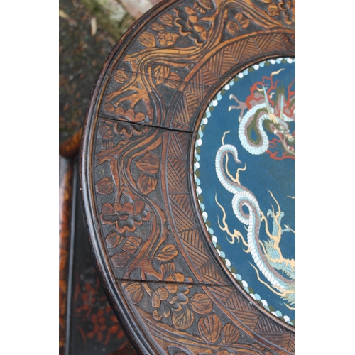 1028 - A CHINESE STYLE HARDWOOD CIRCULAR FAUX BAMBOO TABLE WITH INSET CIRCULAR CLOISONNE PLAQUE, the hardwo... 