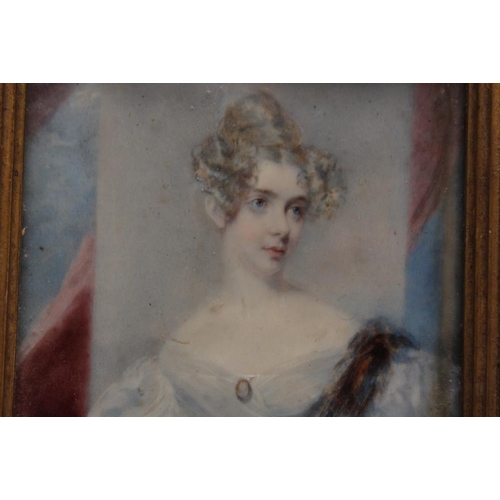 259 - (XIX). Portrait miniature on ivory, study of an elegant young lady standing before a pillar, landsca... 