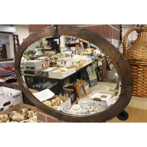 118 - A COPPER FRAMED ARTS AND CRAFTS STYLE OVAL WALL MIRROR - OVERALL 60CM X 86CM