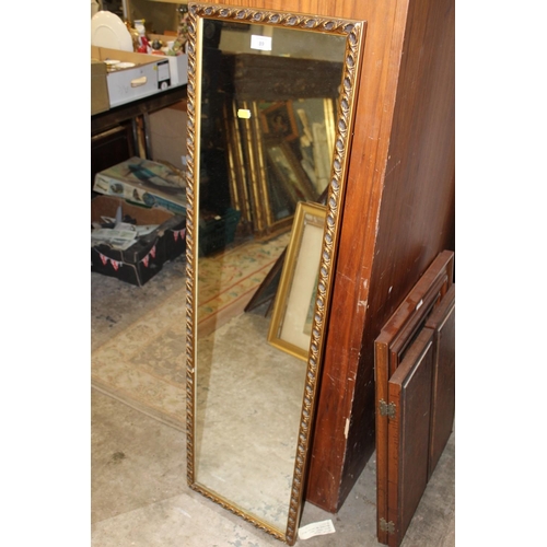 89 - A GILT FRAMED WALL MIRROR OVERALL SIZE - 122CM X 35CM