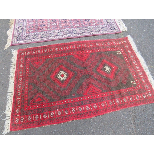 694 - AN EARLY 20TH CENTURY WOOLLEN RUG 163 X 96 CM AND A MODERN RUG 174 x 83 CM (2)