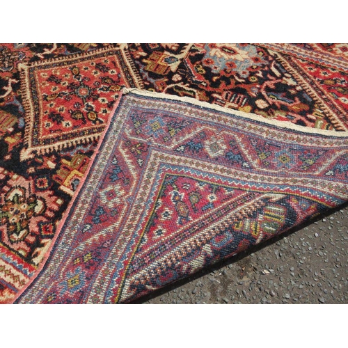 695 - TWO EARLY 20TH CENTURY RED/PINK WOOLLEN RUGS, LARGEST 208 X 136 CM , SMALLEST 163 X 96 CM(2)