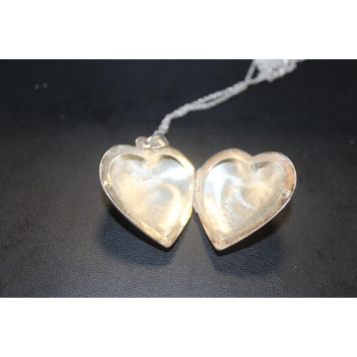 333 - A LARGE STERLING SILVER HEART SHAPED LOCKET ON CHAIN TOGETHER WITH A SILVER AND OPAL PENDANT ON CHAI... 