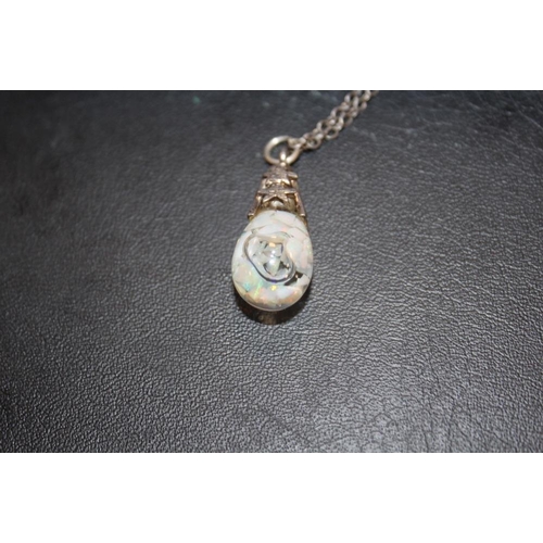 333 - A LARGE STERLING SILVER HEART SHAPED LOCKET ON CHAIN TOGETHER WITH A SILVER AND OPAL PENDANT ON CHAI... 