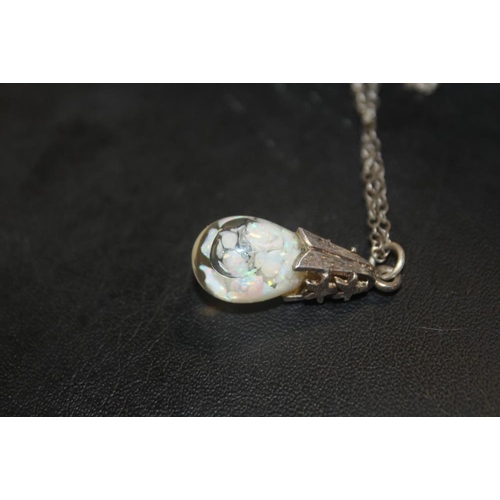 333 - A LARGE STERLING SILVER HEART SHAPED LOCKET ON CHAIN TOGETHER WITH A SILVER AND OPAL PENDANT ON CHAI... 