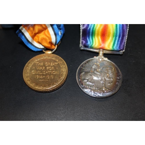 337 - A PAIR OF WWI MEDALS AWARDED TO M-205338 SGT. E.S. CLARKE A.S.C. IN AN OAK GLAZED DISPLAY CASE