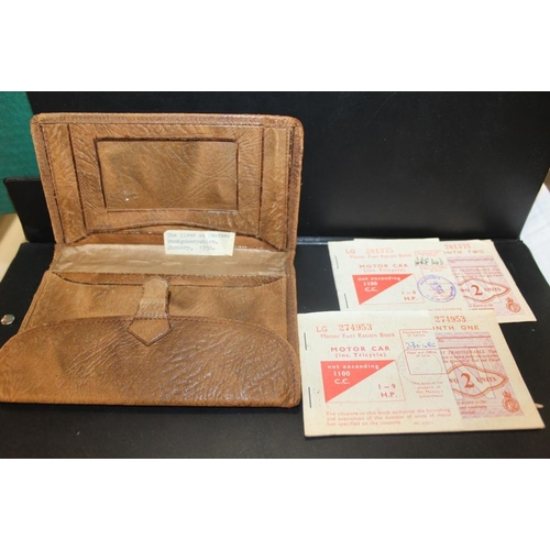 349 - A VINTAGE LEATHER PURSE CONTAINING MOTOR CAR FUEL VOUCHERS