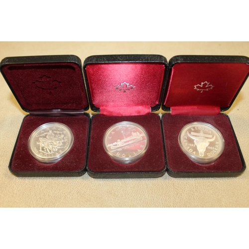 353 - THREE CASED SILVER CANADIAN DOLLAR PROOF COINS