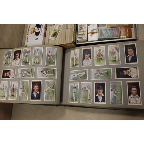 366 - A FOLDER OF VINTAGE CIGARETTE CARDS, TOGETHER WITH TWO BOXES OF LOOSE CIGARETTE CARDS AND TEA CARDS