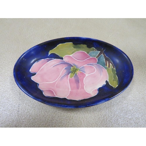 278 - A MOORCROFT MAGNOLIA PATTERN PIN DISH TOGETHER WITH A GOEBEL FIGURE (2)