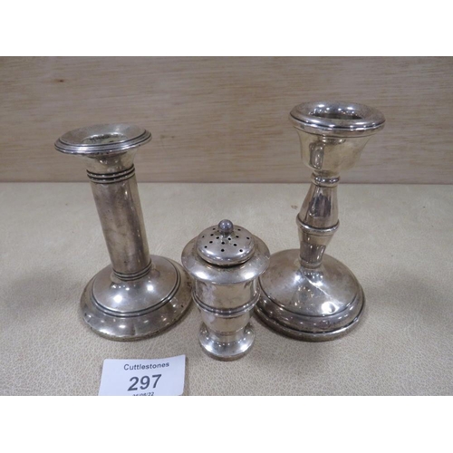 297 - TWO HALLMARKED SILVER CANDLESTICKS, TOGETHER WITH A HALLMARKED SILVER PEPPERETTE (3)