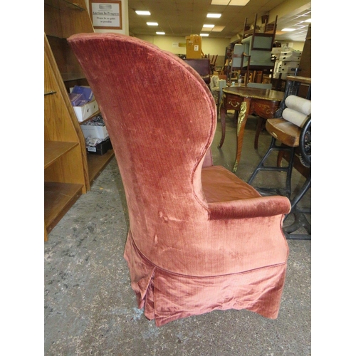 696 - A LARGE VINTAGE UPHOLSTERED TUB TYPE ARMCHAIR