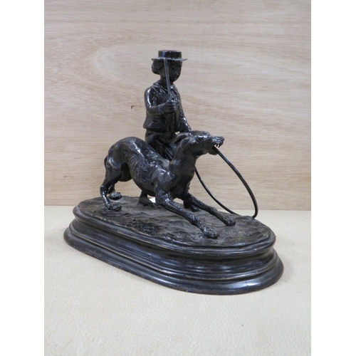 243 - A BRONZE OF A MAN AND DOG SIGNED J. MOIGVIER ? - W 22 CM